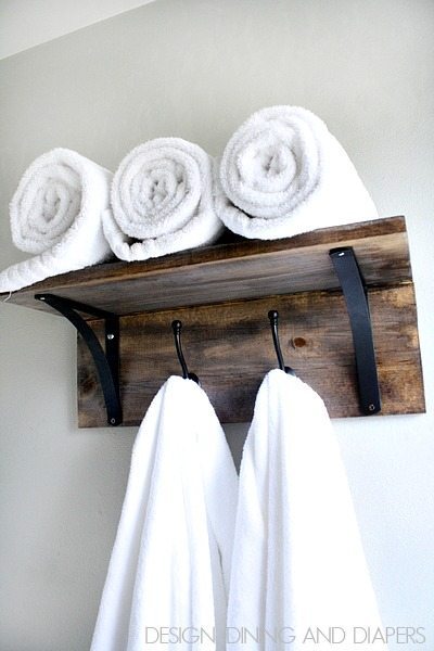 DIY Towel Organizer! This easy bathroom project will take you no time. Don't worry about folding those towels anymore, just hang and go!