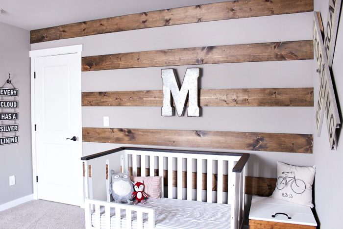 Turn that large blank wall into a wood accent wall by adding stripes with wood! 