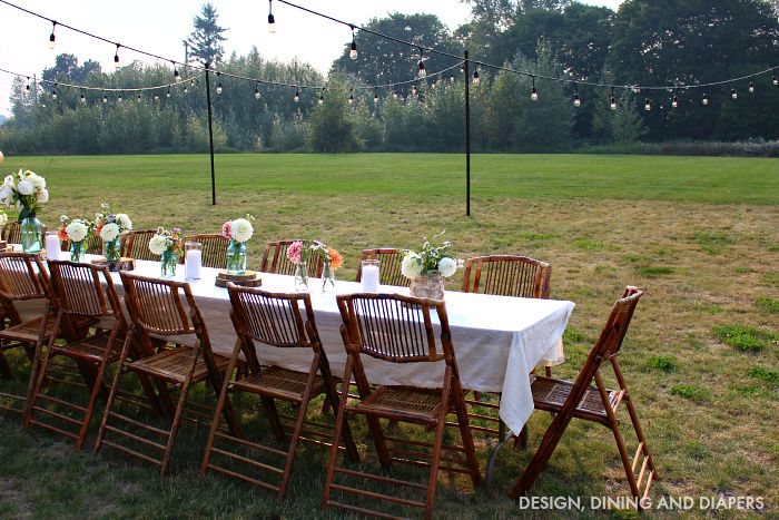 Tips for installing outdoor lights in your backyard! Create a magical summer evening by stringing lights for your guests to sit under. 