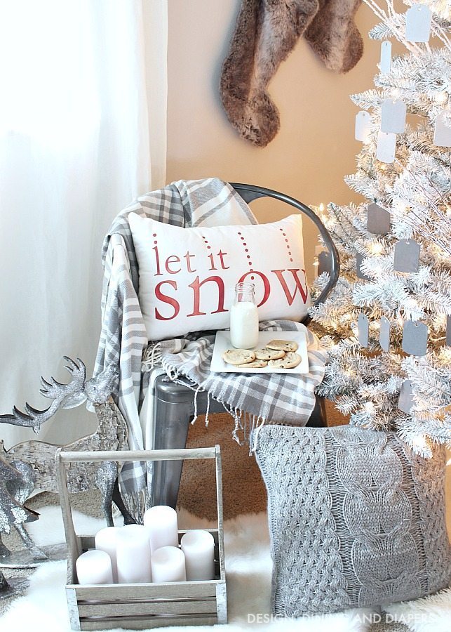 Create a magical rustic modern Christmas display using a white Christmas tree and ombre gray ornaments. The pops of red on this Christmas display keep your eye moving and pulls you in. Such a dreamy setting. 