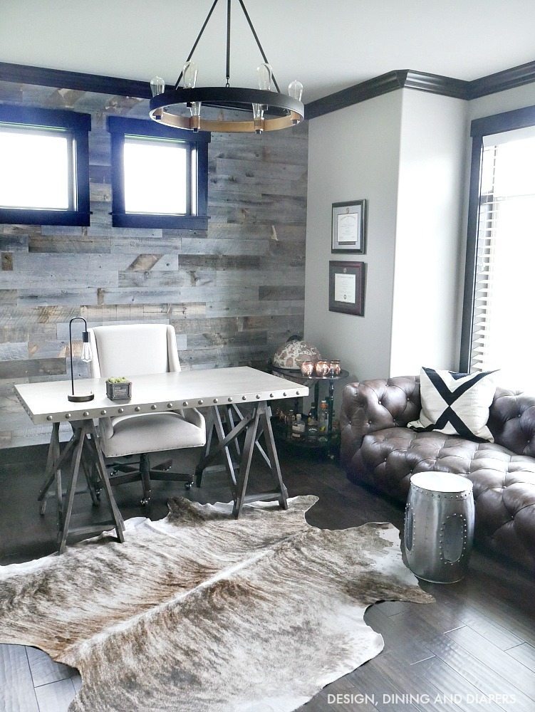 Modern Rustic Office - Come take a tour of this home office with dark wood trim and masculine touches. The reclaimed wood wall makes such a statement. 