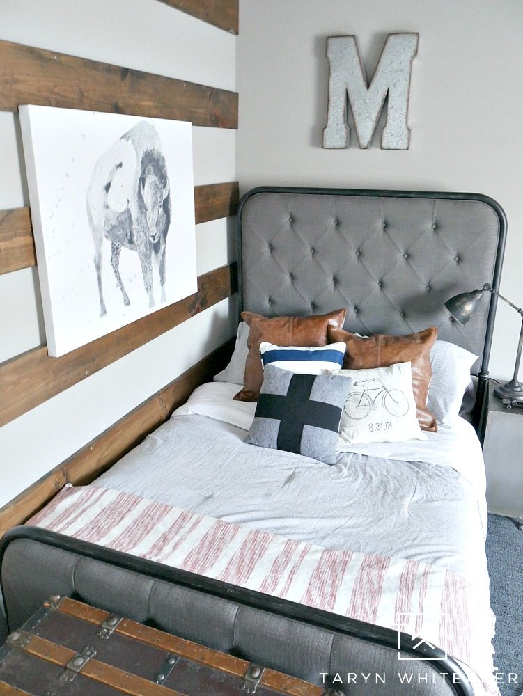 Modern Farmhouse Boy Room with wood striped wall and black and white animal print!