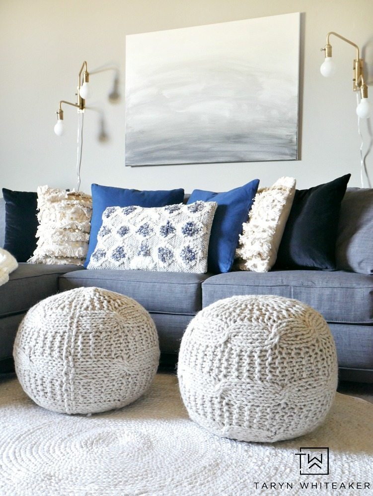 Create a sleek yet cozy space with this modern boho decor look for a small seating area. The mix of black, cream and indigo blue bring a neutral yet bold look to the space.