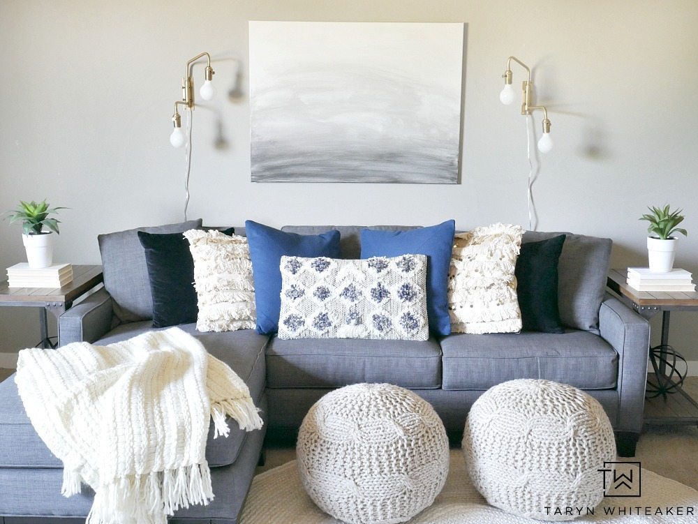 Create a sleek yet cozy space with this modern boho decor look for a small seating area. The mix of black, cream and indigo blue bring a neutral yet bold look to the space.