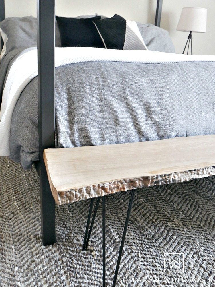 A rustic modern bedroom mixing steel, wood and lots of neutral textures