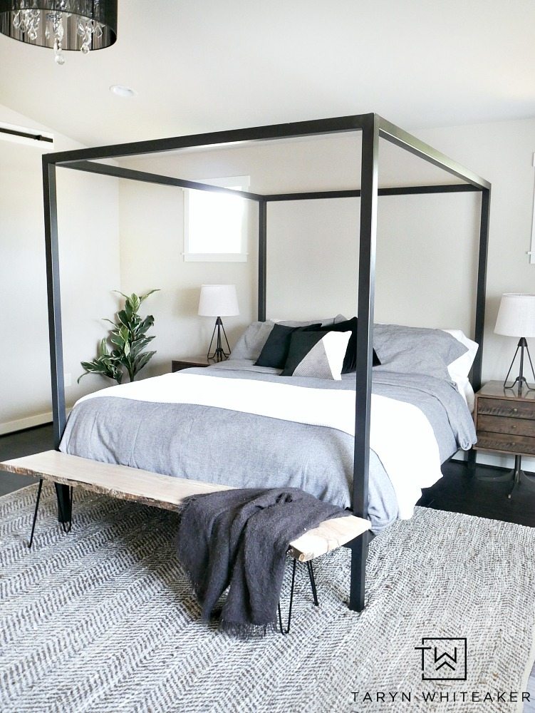 Get a clean and modern look for your bedroom with this Modern Steel Canopy Bed with gray bedding from Room & Board 