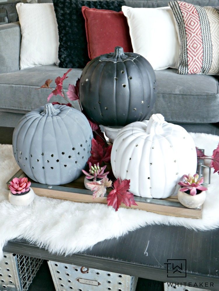 Create these more modern looking decorative pumpkins using a power drill and paint! These DIY Drilled Pumpkins are so easy to make and you can customize the design to you liking! 