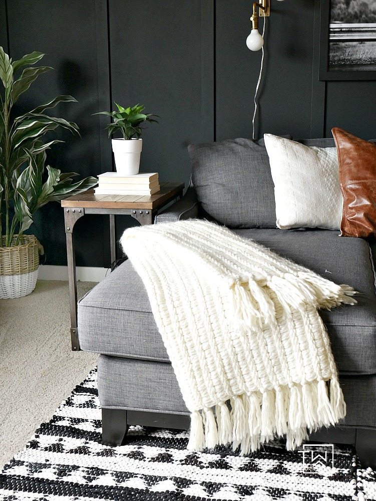 Looking for a bold look? Check out this Dark Moody Room Makeover with rustic modern decor. The dark walls make a big impact but also give it a cozy look. 