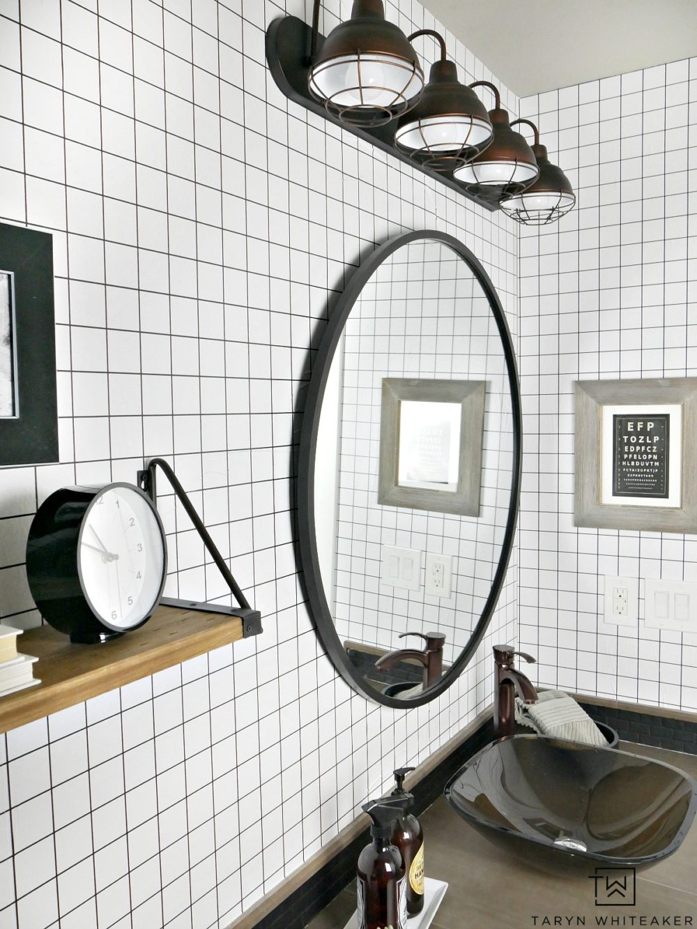 Easily transform you boring space into this black and white geometric bathroom using grid patterned wallpaper and modern industrial accents! Click for the before photos, you won't be disappointed!