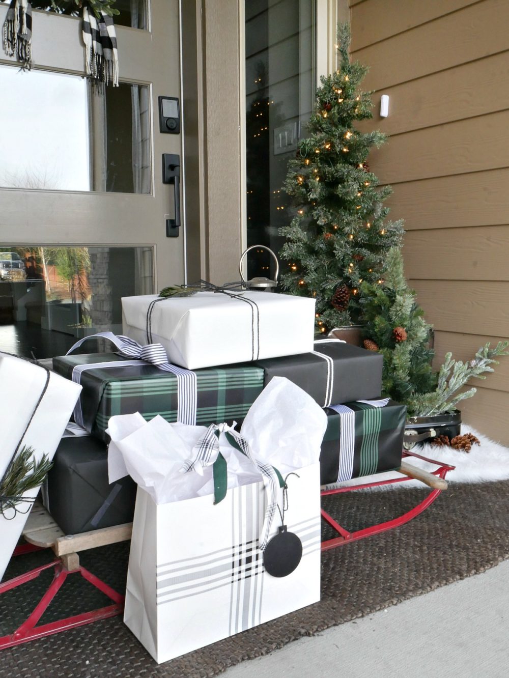 Christmas porch - a welcoming sight with a sleigh of presents 