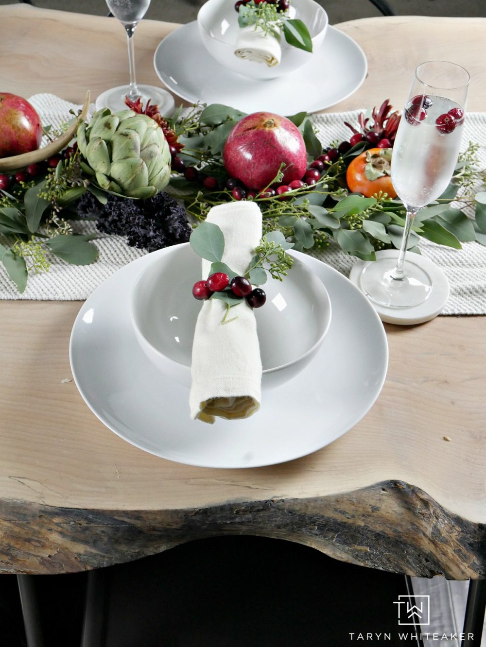 Simple Thanksgiving tablescape using cranberries for napkin rings and fresh fruits and veggies for the centerpiece