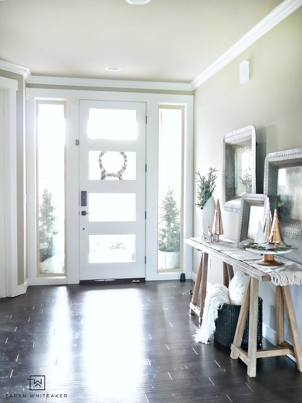 Simple, serene entryway that focuses on clean lines and pops of texture. This Christmas Entry way is filled with simple yet meaningful decor. 