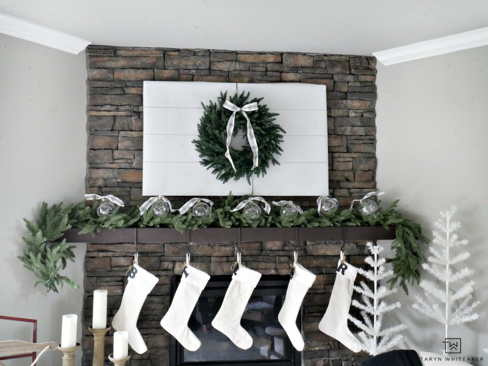 Cover your TV with butcher paper and hang a wreath to hid it for those holiday parties! It's an easy way to transform your vignette and keep people focused on the company not the screen. 