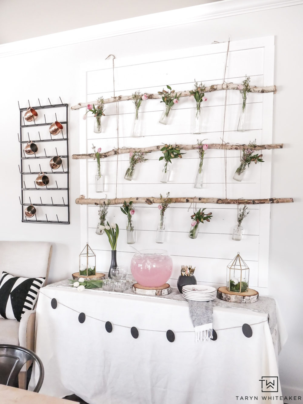 Great this DIY Hanging Floral Backdrop that is perfect for a spring or Easter entertaining! These Hanging Jars from birch branches are an easy DIY project that will wow your guests!