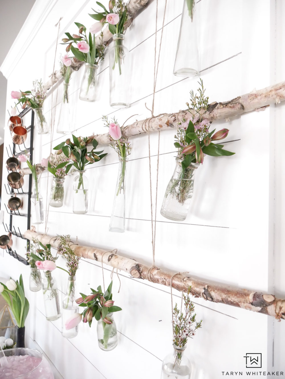 Easily create this Hanging Branch Display with fresh garden flowers for your next spring party!