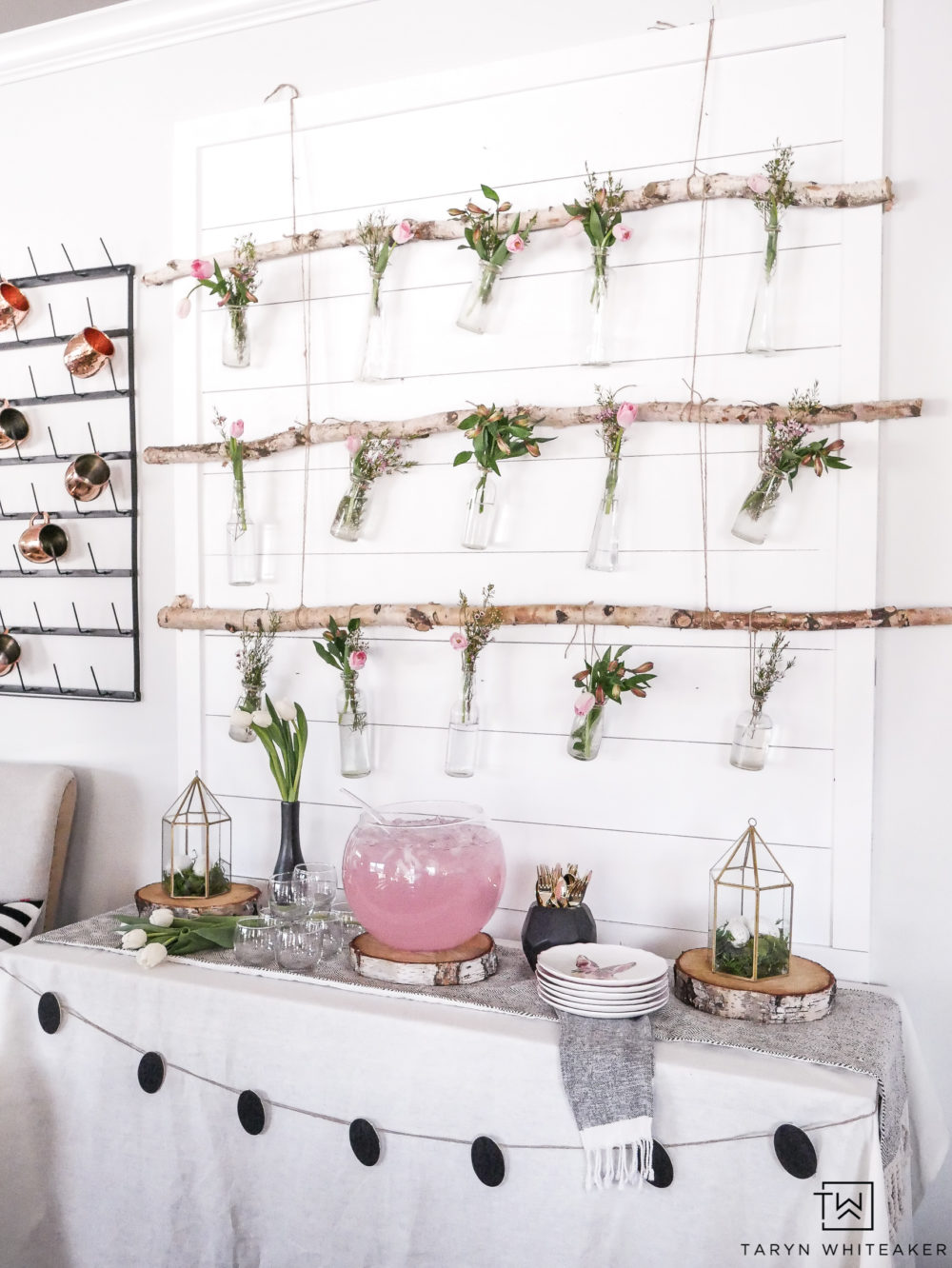 Great this DIY Hanging Floral Backdrop that is perfect for a spring or Easter entertaining! These Hanging Jars from birch branches are an easy DIY project that will wow your guests!