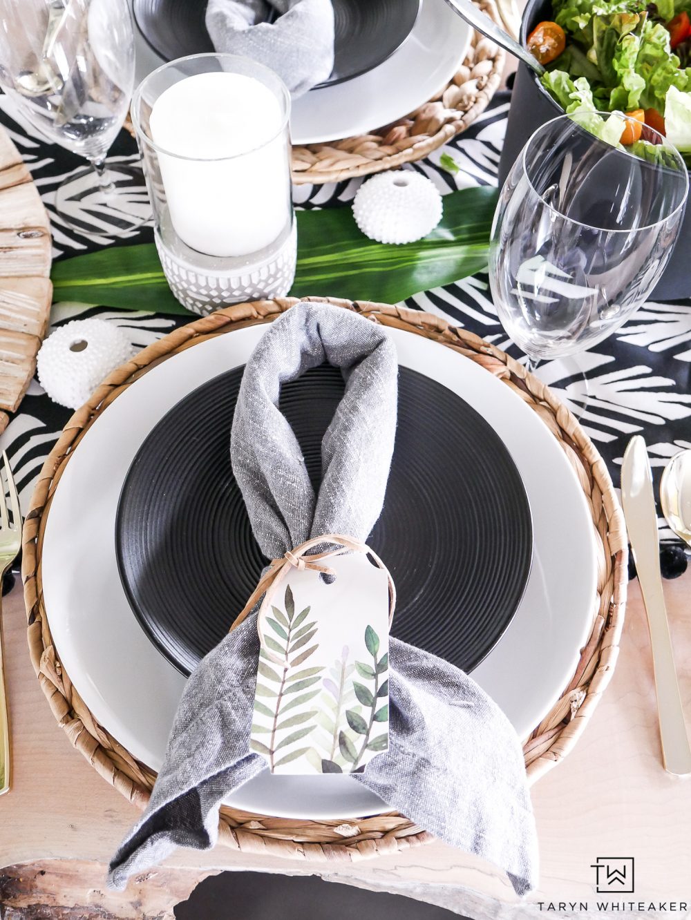 Black and white summer table setting with pops of greenery!