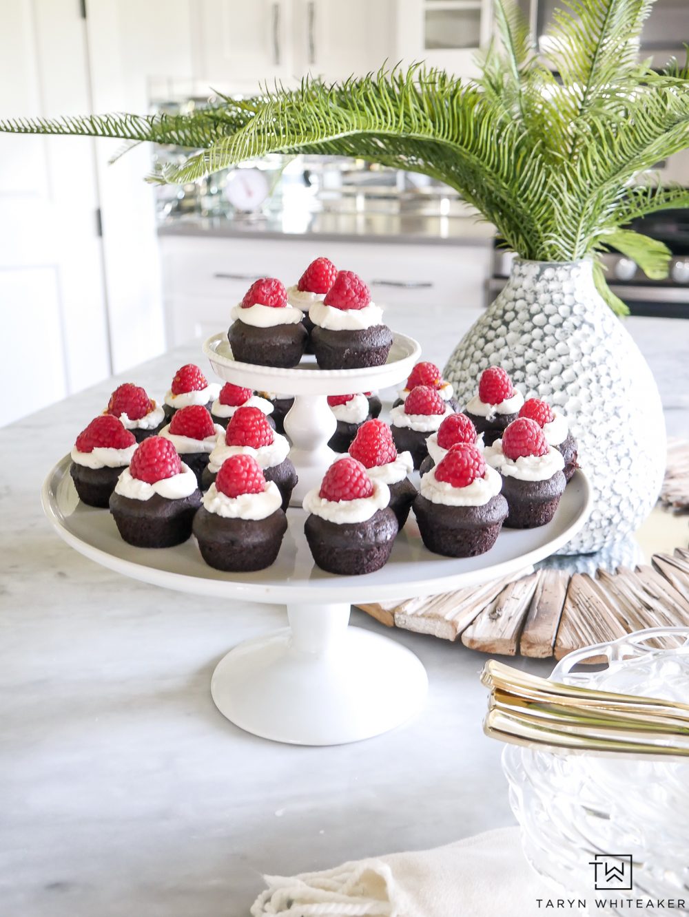 Easy Mini Chocolate Cupcakes With Caramel Filling and raspberries on top! Super simple recipe for bite size desserts! 