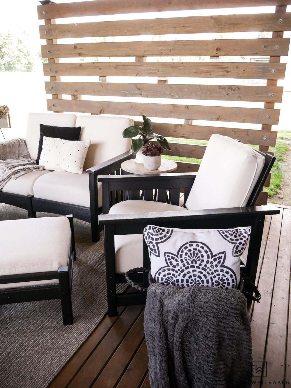 Outdoor Chair with matching Ottoman! Such a pretty outdoor living space and privacy screen. 