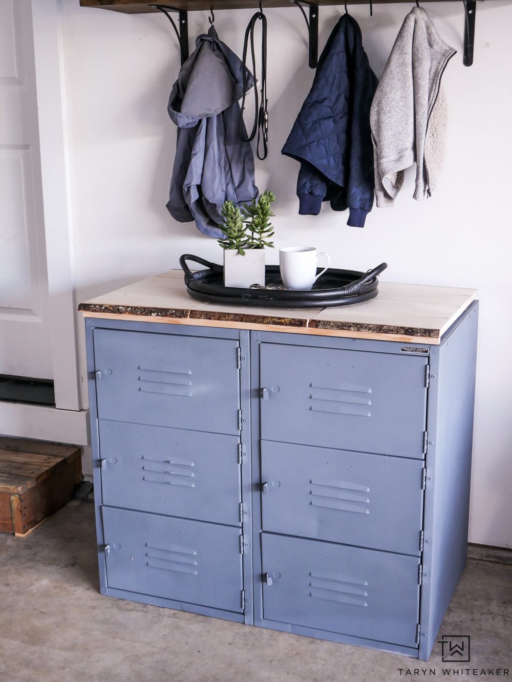 Don't have a mud room? Create more storage in your garage with this locker set up and shelf above! Great for storing sports equipment and tons of shoes! See, garages can be decorated too!