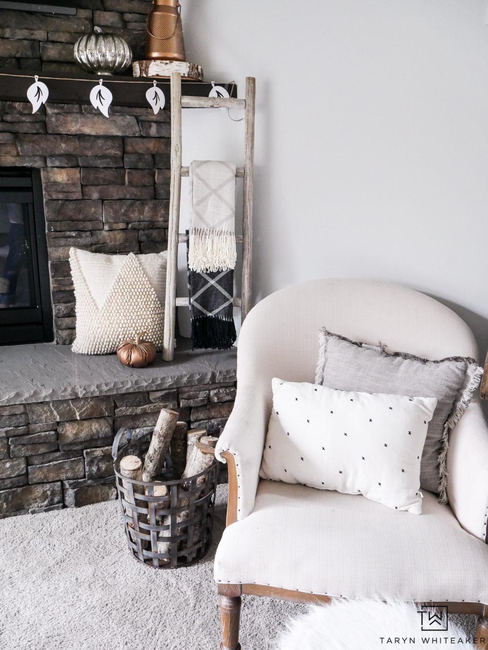 Bring together all these natural textures to create a beautiful look for fall. From the wood blanket ladder, basket full of logs, wheat strands and pops of fur. 