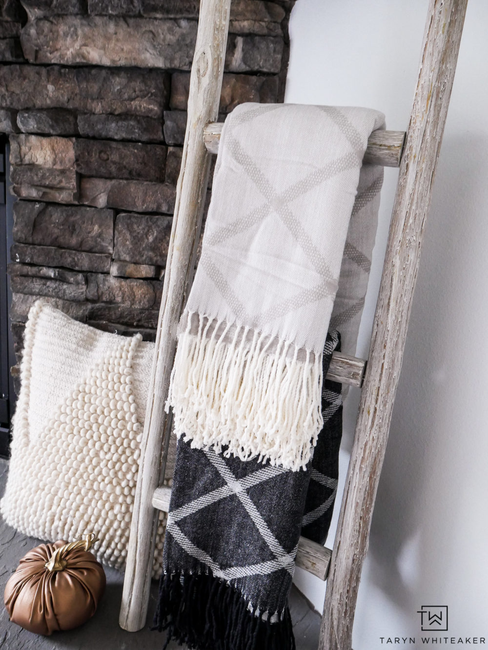 Cute way to display blankets for fall around the fireplace. 