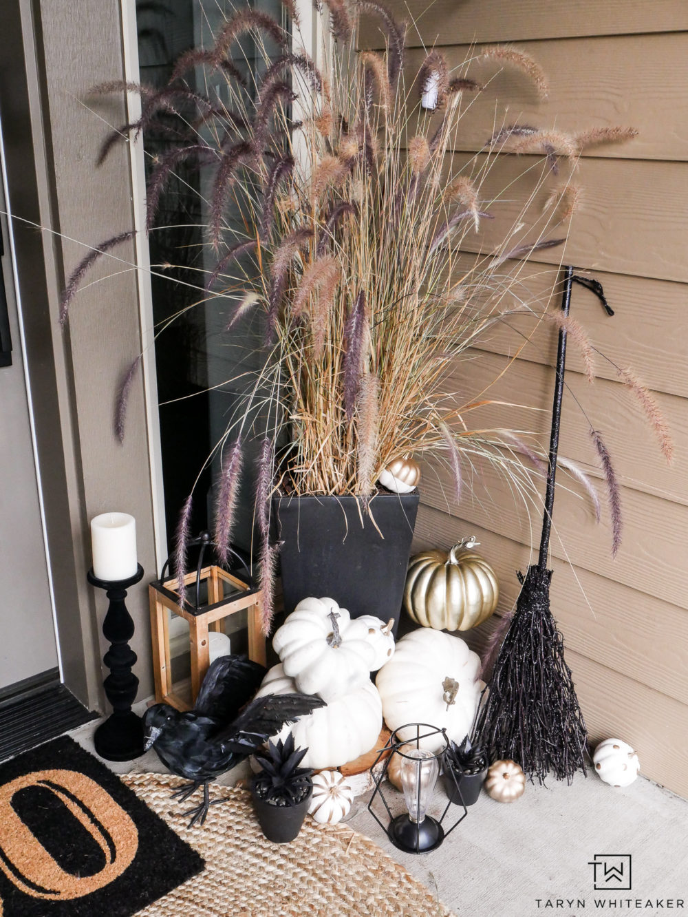 Easily transition your fall porch into Halloween with lots of black and white pumpkins, creepy crows and lights!