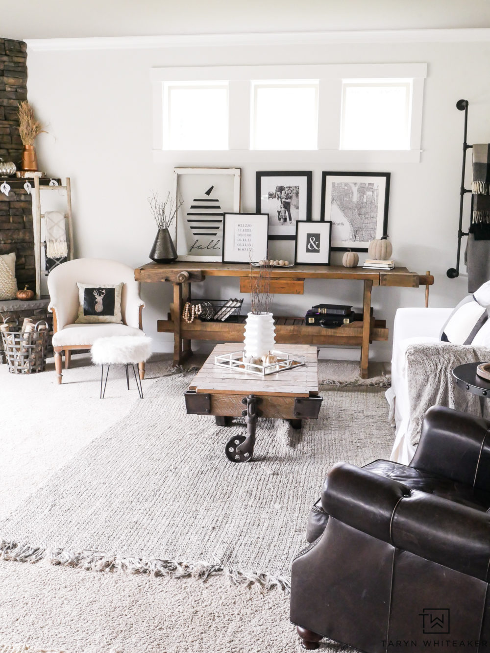 A neutral rustic modern living room all ready for fall with cozy textures and warm tones. 