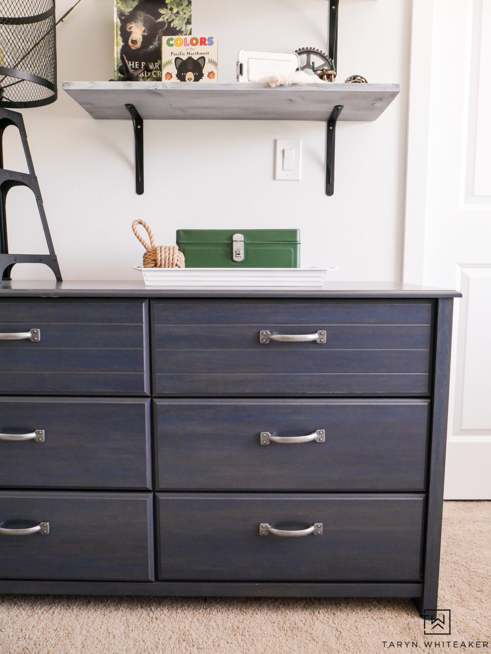 This distressed blue dresser is the perfect pop of color for this space!