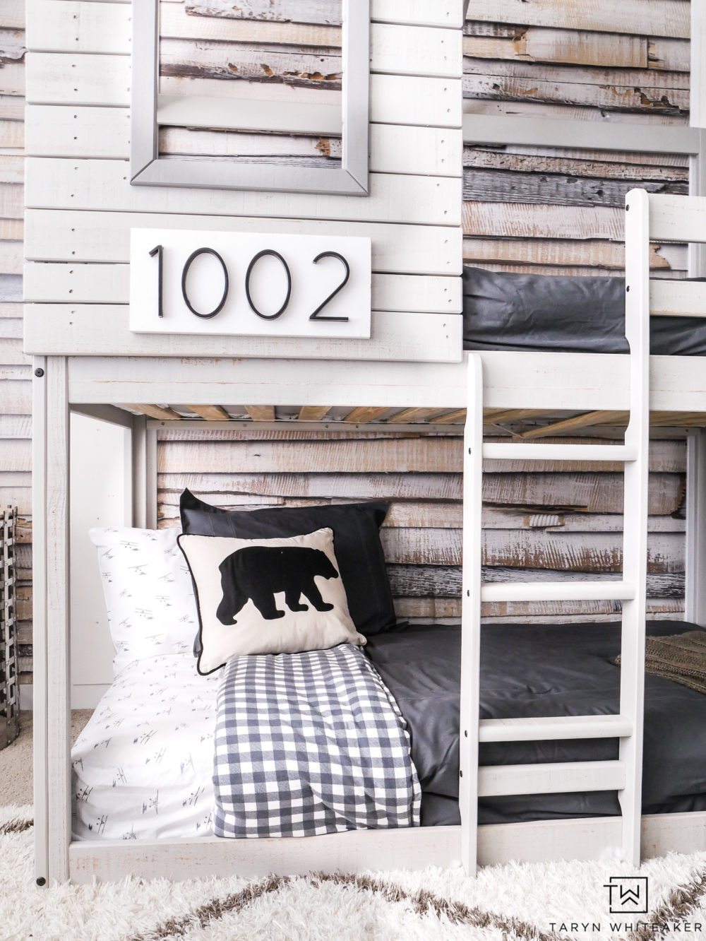 Personalize your bunkbed by using special numbers as "house numbers". This cabin like bunkbed is too cute for this outdoor inspired boys room. 