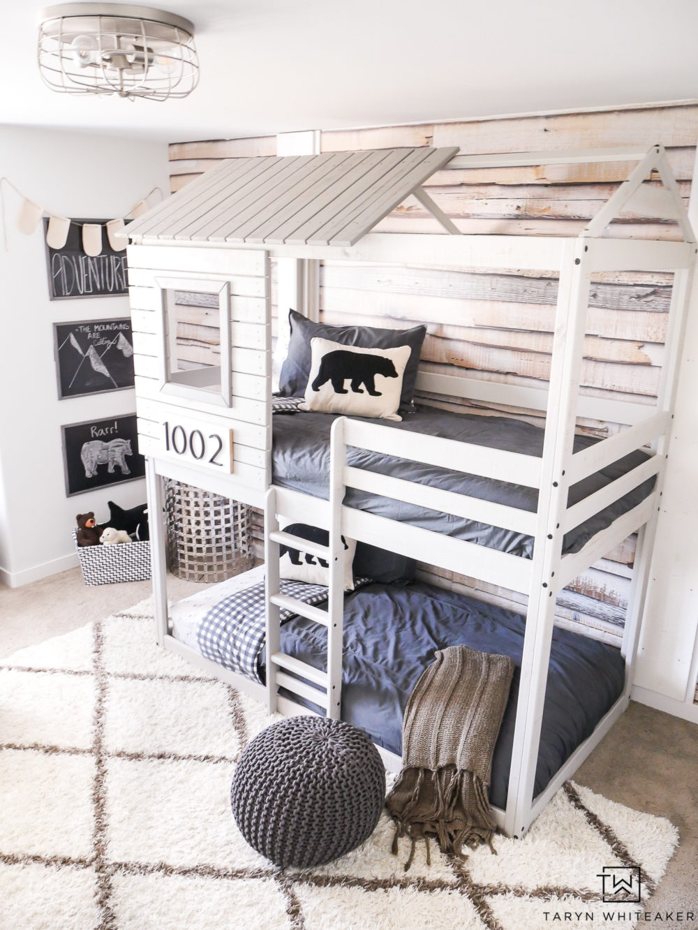 Take a tour of this Modern Adventure Boys Bedroom complete with a treehouse bunkbed and bear accents.