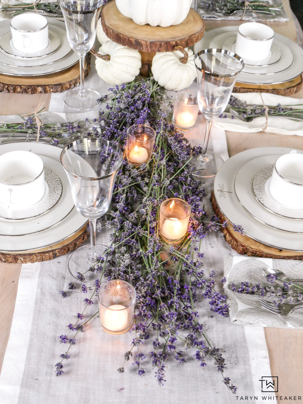 Create a classy and elegant Lavender Fall Tablescape filled with blooms from your own yard! Give it a fall look using white pumpkins and tea light candles. 