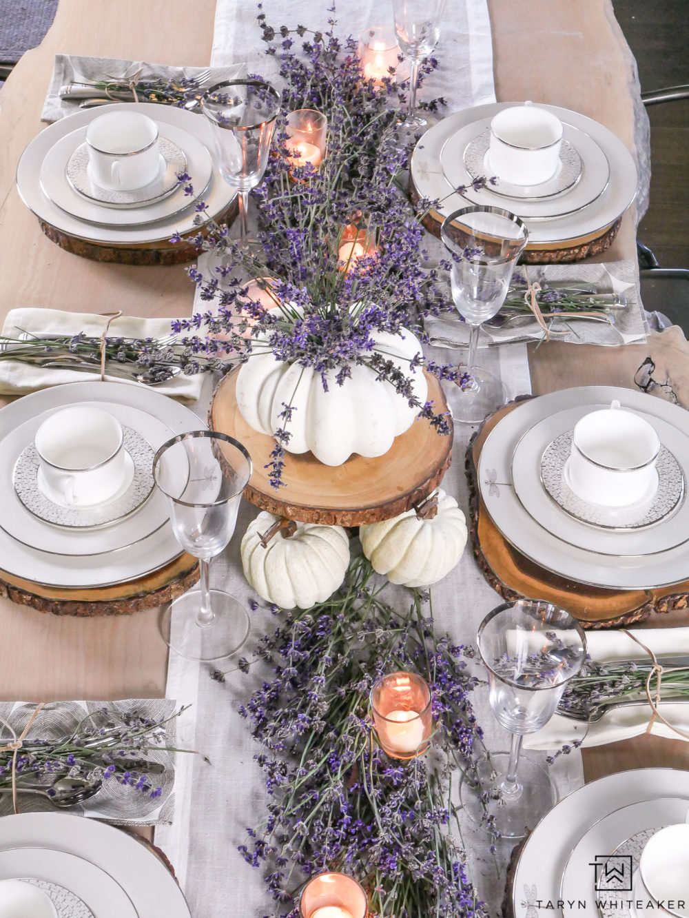 Create a classy and elegant Lavender Fall Tablescape filled with blooms from your own yard! Give it a fall look using white pumpkins and tea light candles. 