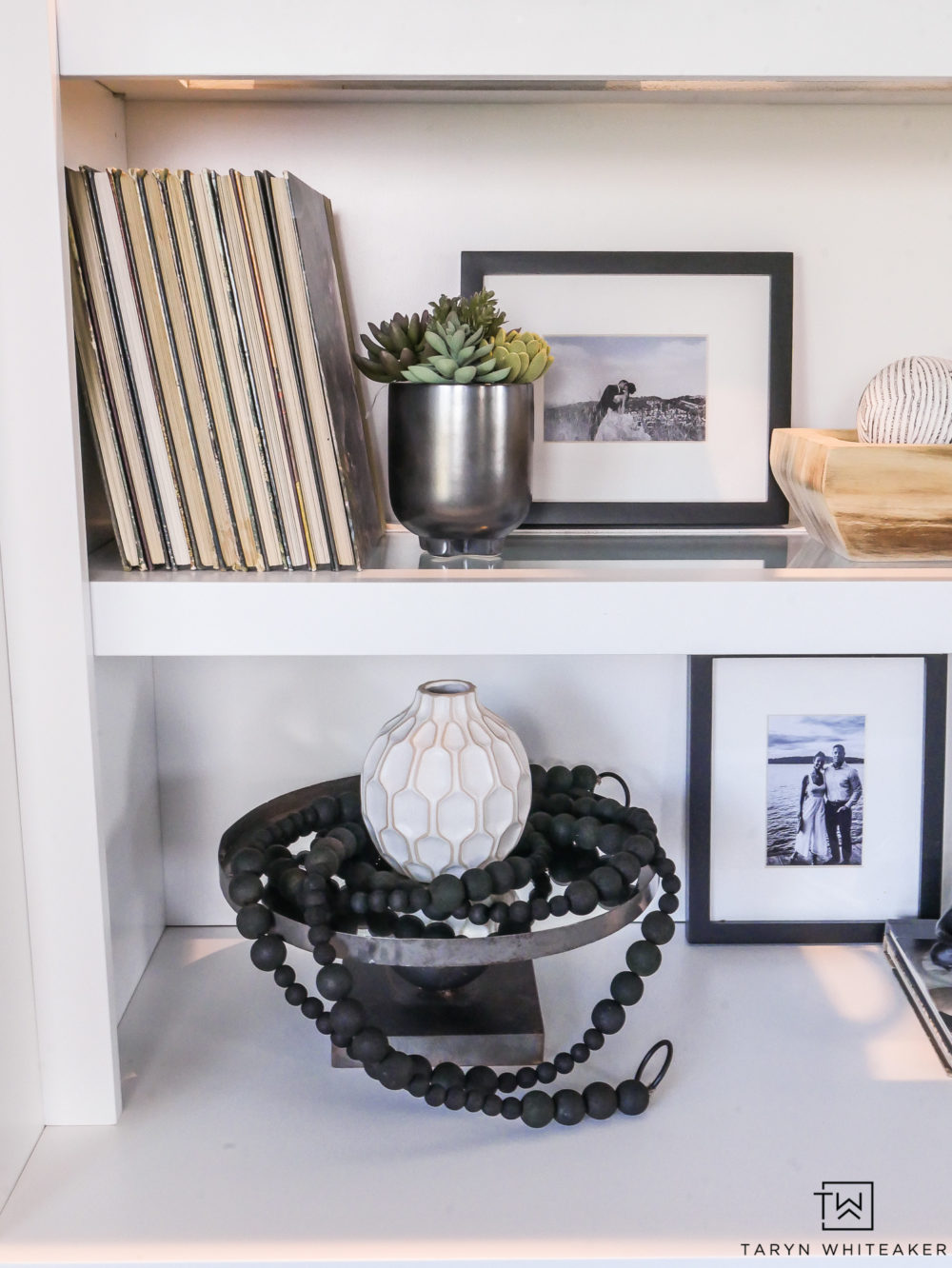 Black and white decor on open shelves. 