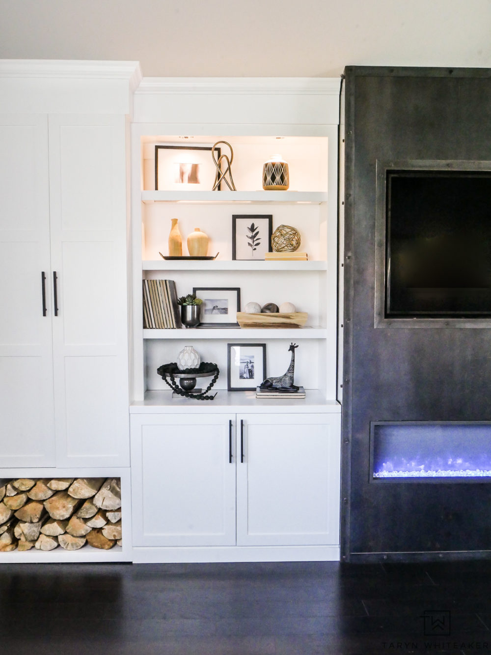 Custom craftsman built ins with open shelving and firewood storage! Love this rustic modern space for a living room or master bedroom!