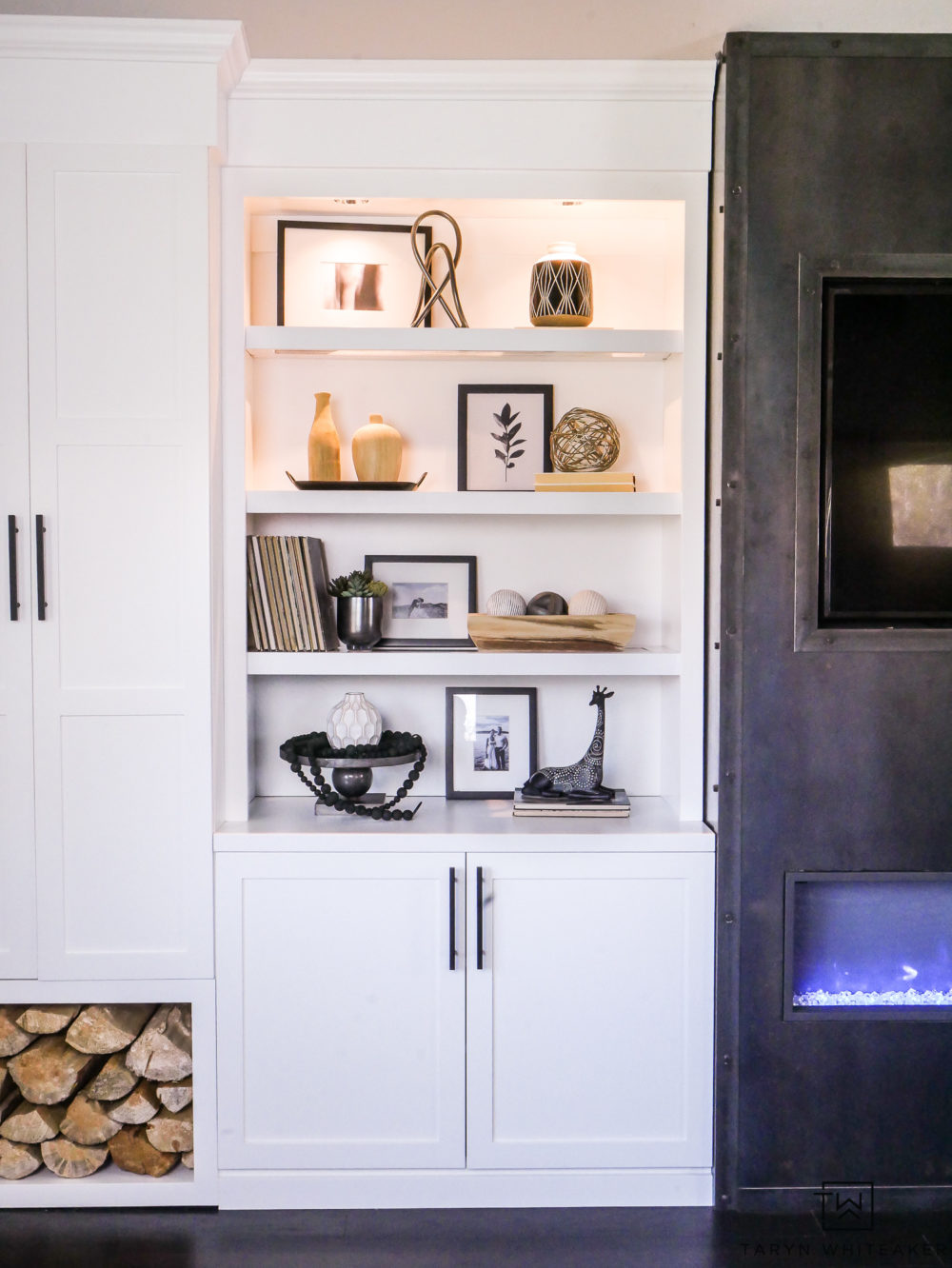 White craftsman built ins with built in lighting. Love the wood storage for rustic look. 