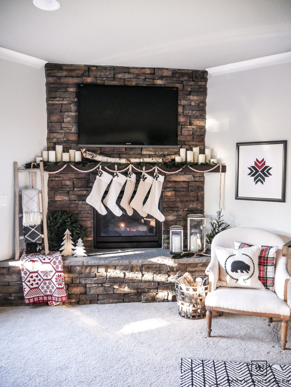 Nordic Christmas Mantel using natural elements and pops of red and green. 