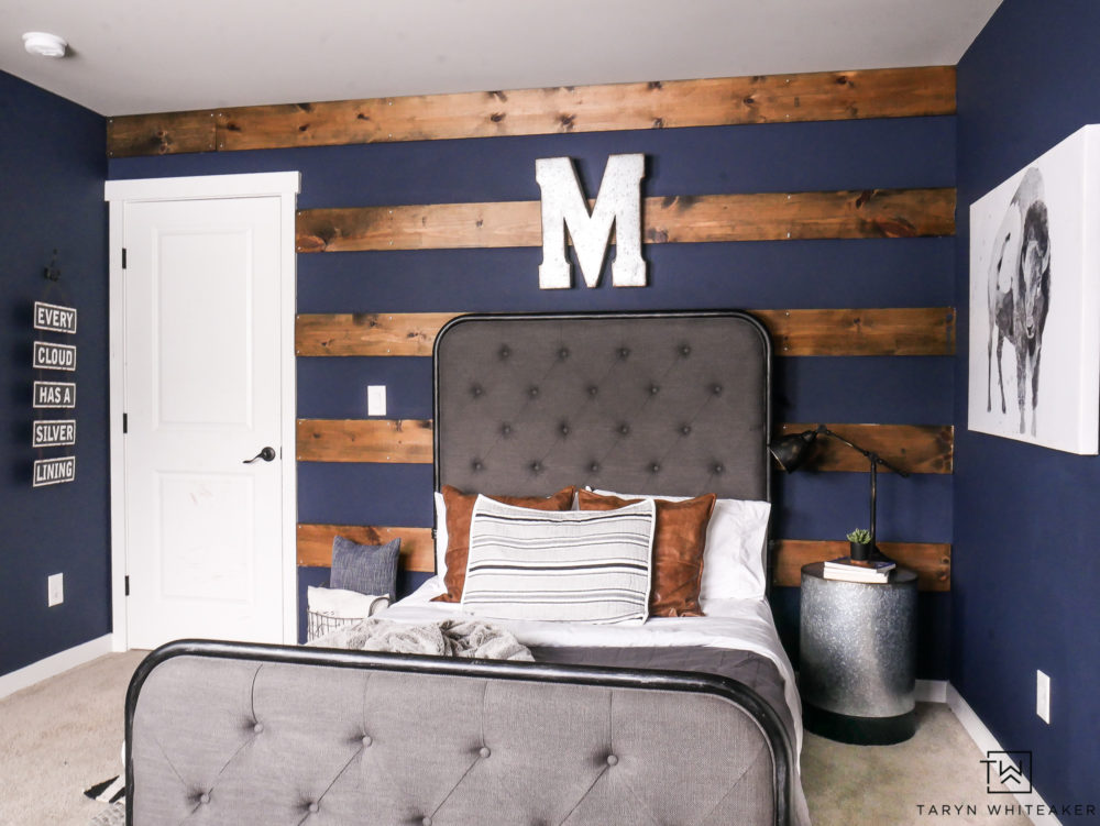 Awesome wood striped wall with dark navy walls behind. Love this rustic boys room with modern farmhouse style. 