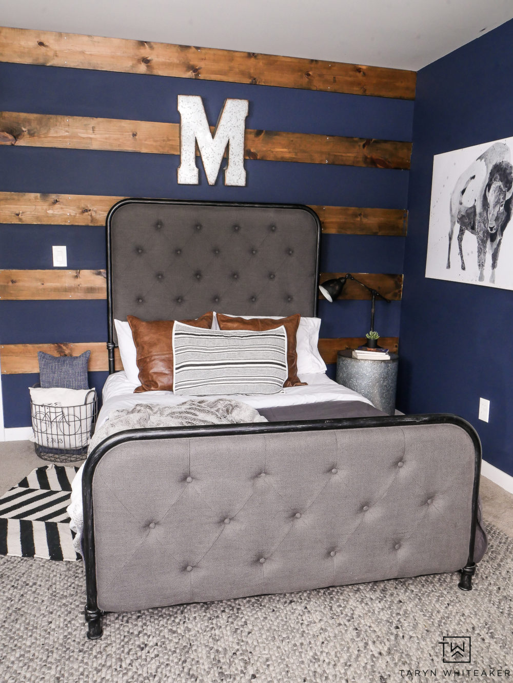 Love this rustic boy's room with dark navy walls, wood accents and unique touches. 