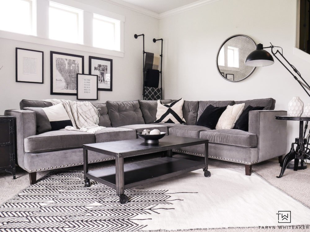 Gray sectional with with black and white decor. Ideas for how to style a corner sectional. 