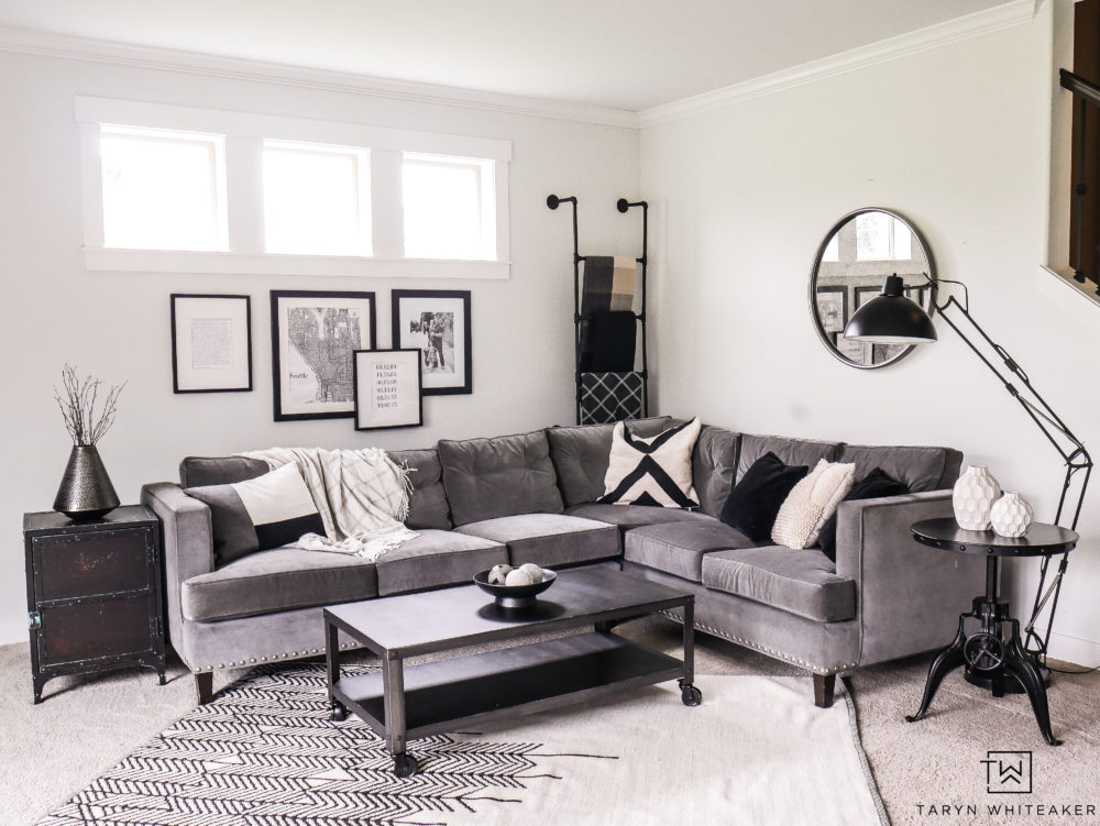 Gray sectional with with black and white decor. Ideas for how to style a corner sectional. 