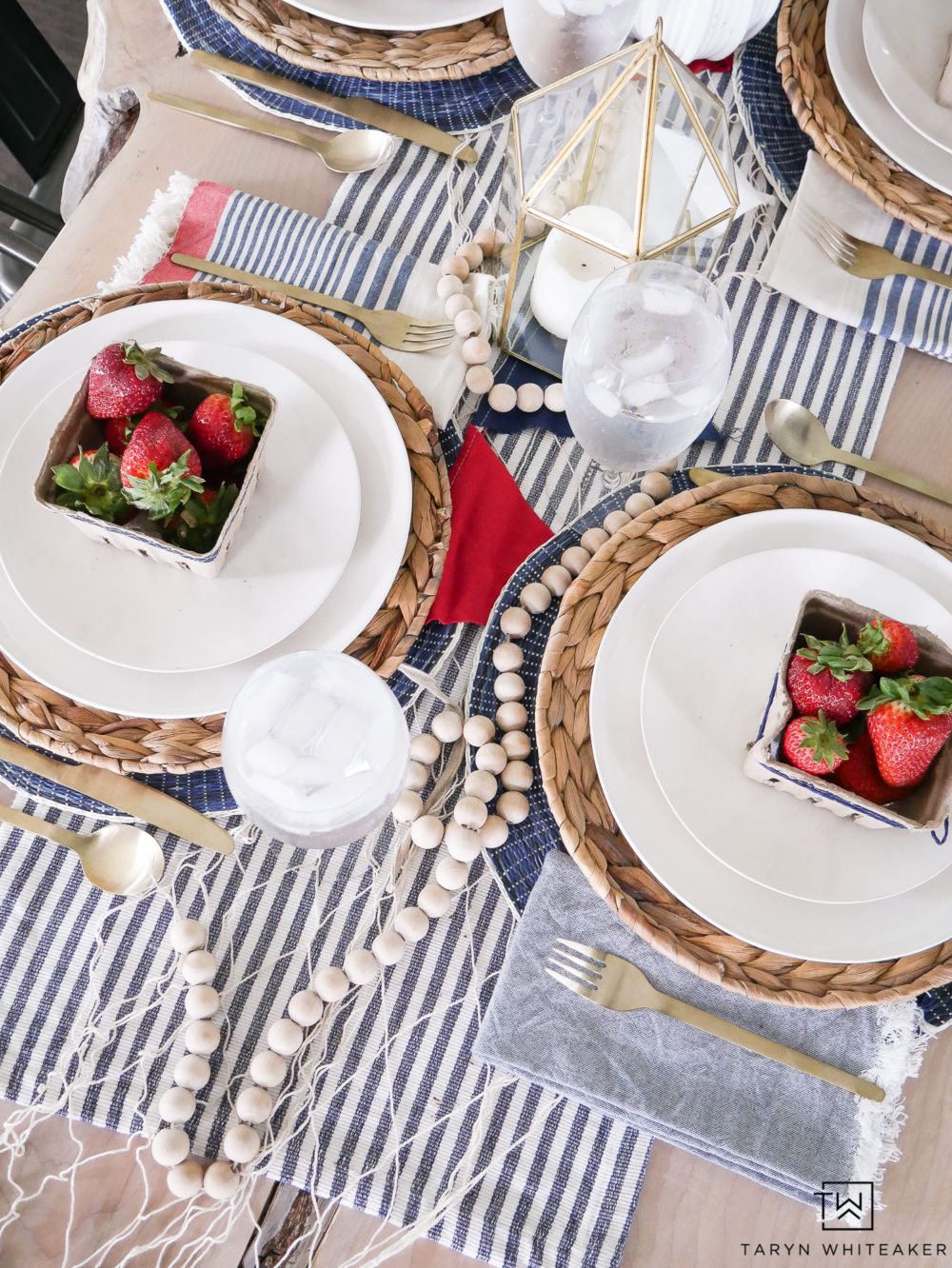 Fresh summer tablescape with nautical theme and fresh berries. Perfect for summer dinner decor!