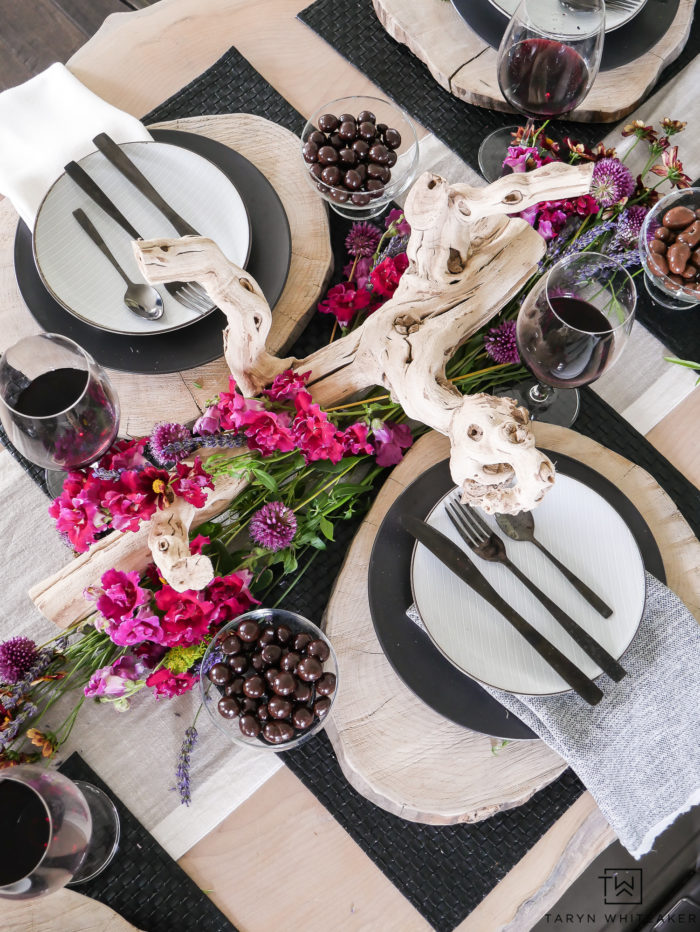 Beautiful rustic modern table design featuring natural elements from drift wood centerpiece with farm fresh flowers and wood charger. 