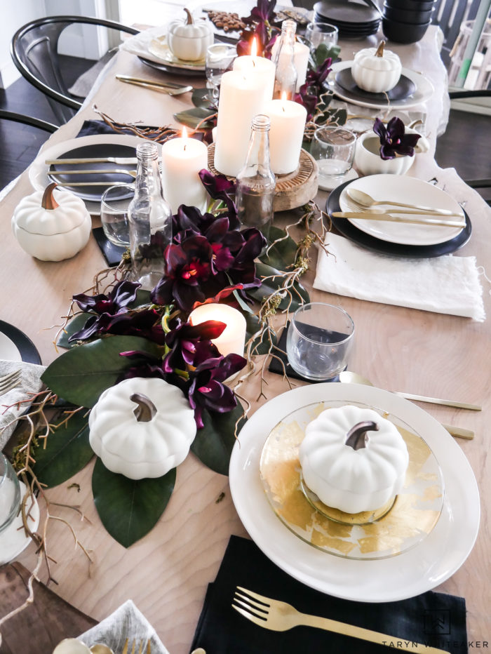 See all the details of this early fall tablescape with black and white fall decor and tons of deep earth tones. This plum fall table decor is so refreshing. 