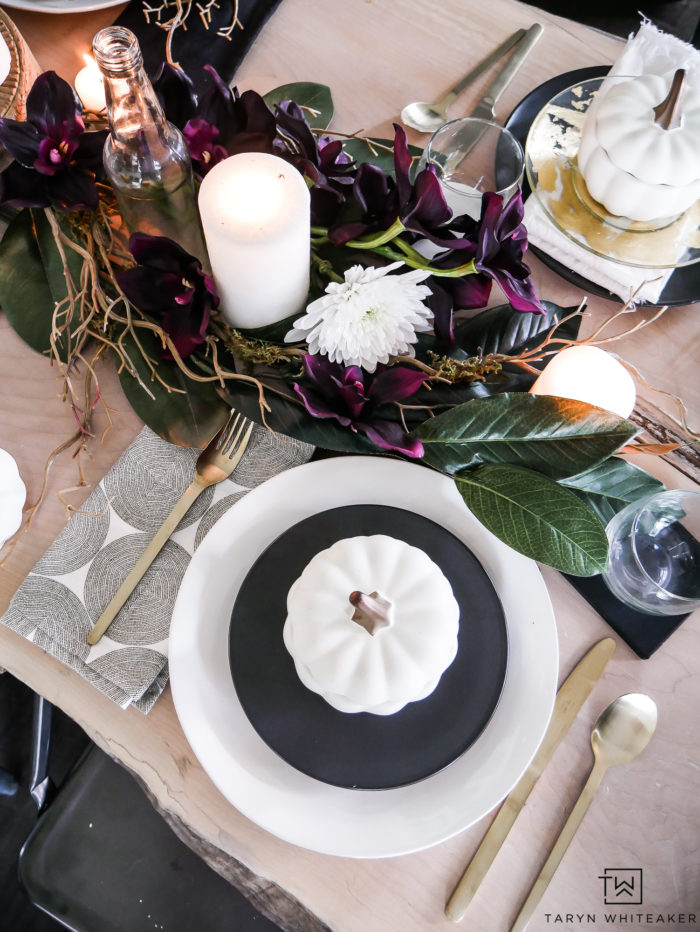 See all the details of this early fall tablescape with black and white fall decor and tons of deep earth tones. This plum fall table decor is so refreshing. 