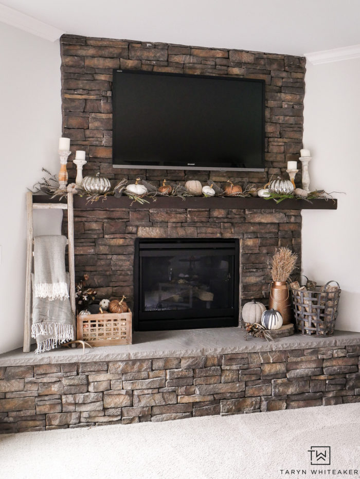 Create an elegant and natural fall mantel using neutral colors, pops of copper and natural fall textures. Love the pumpkin mantel display. 