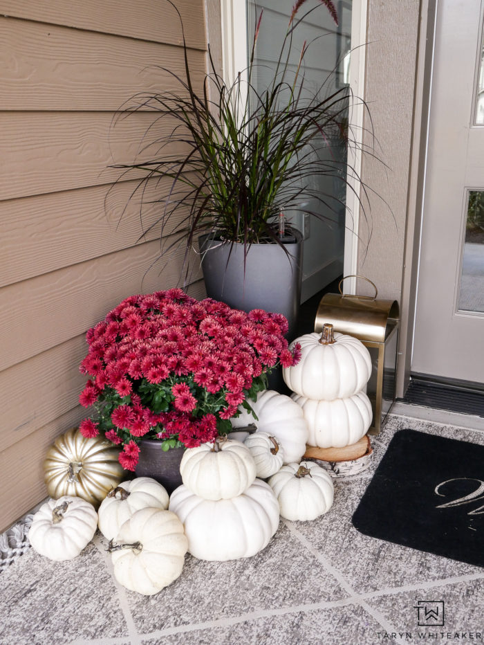 Red mums, white pumpkins, gold lanterns, what more could you want on a fall porch! Click to get the look. 