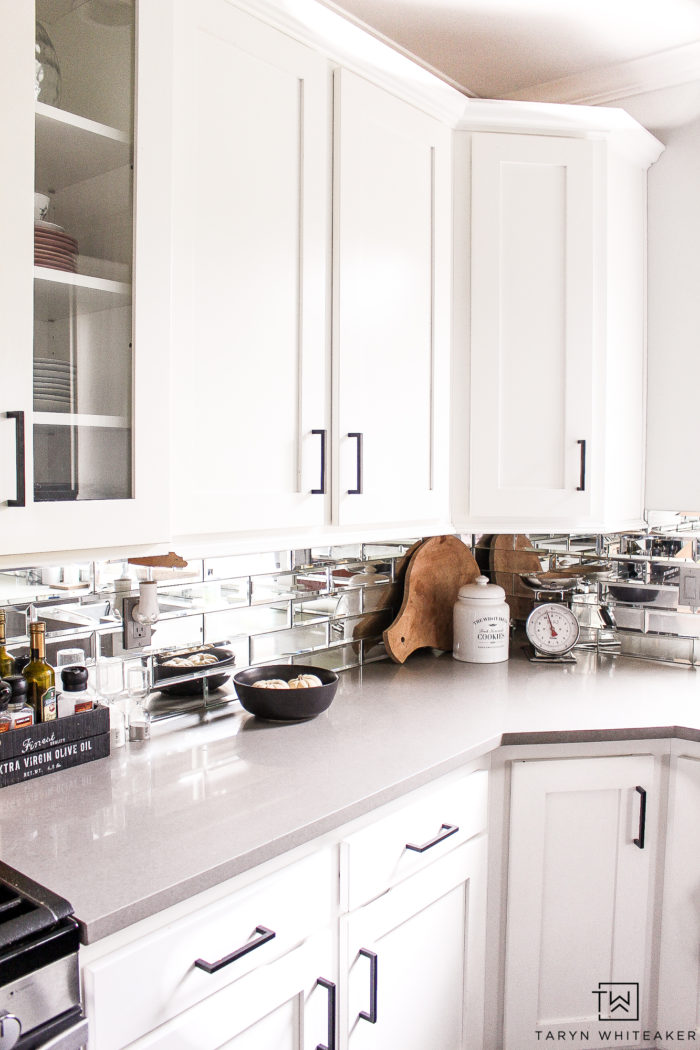 Black and White Modern Kitchen with mirror subway tile. 