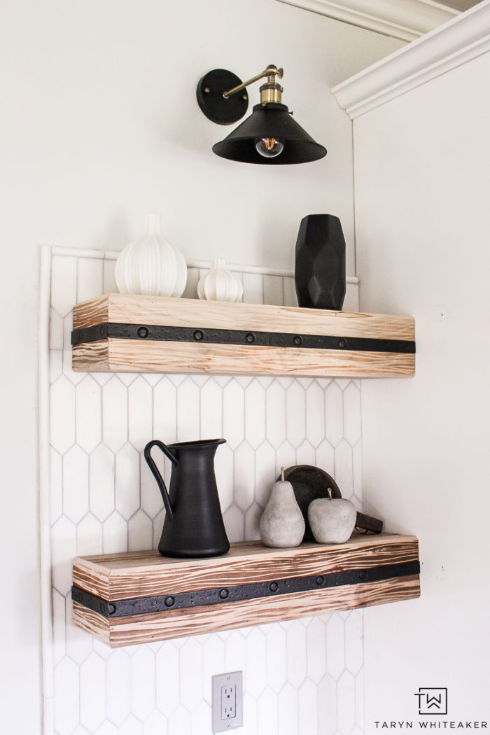 gorgeous rustic shelves against the white marble tile!