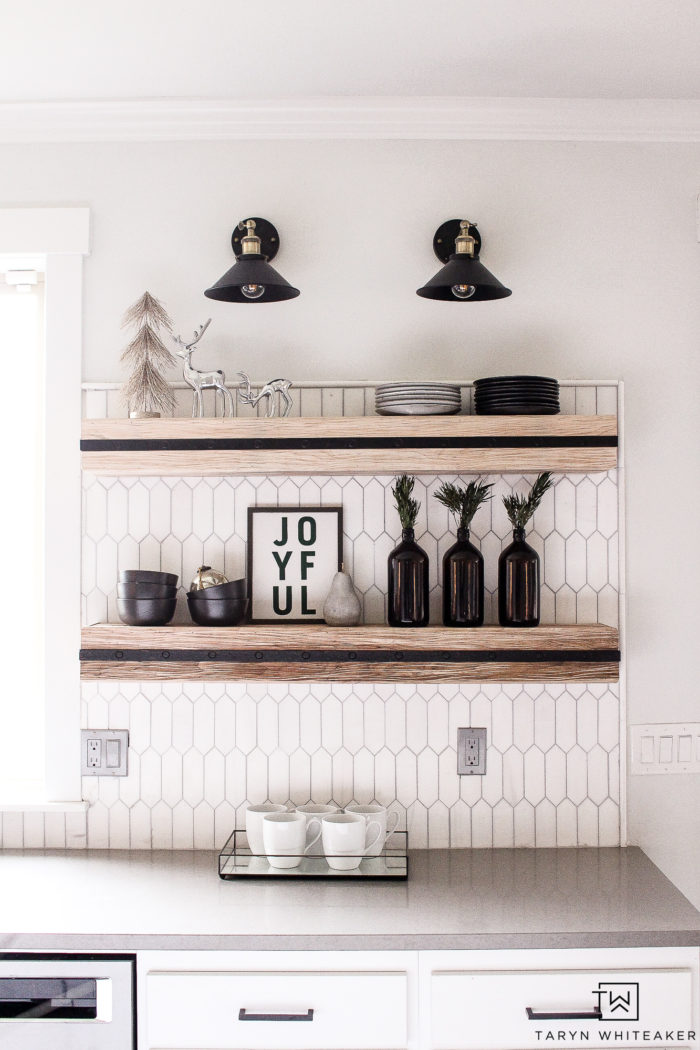 Modern farmhouse kitchen shelves all decorated for Christmas. 